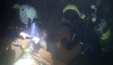 Escavation on the cave's flooded bottom